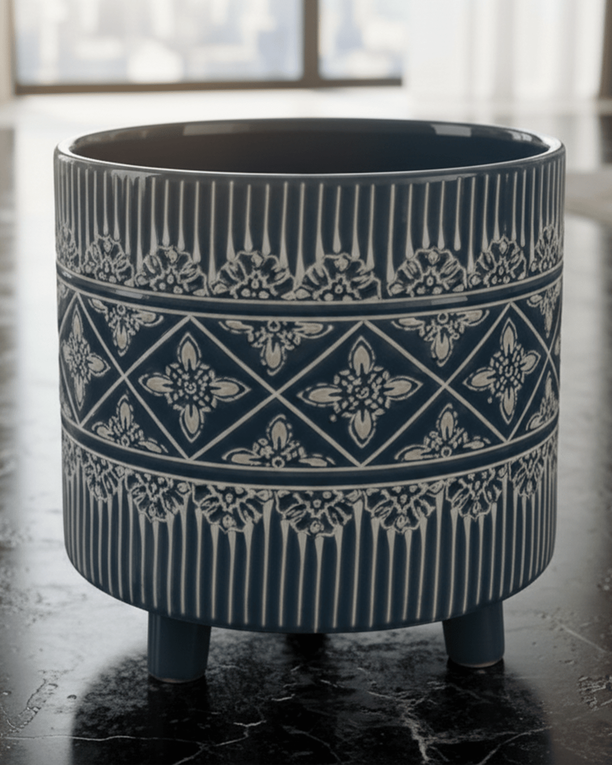 Muro deep navy ceramic planter with carved concrete surface