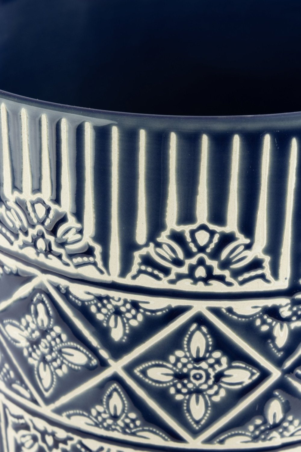 Muro deep navy ceramic planter with carved concrete surface